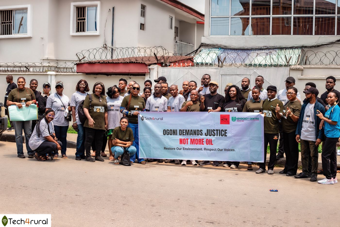 Project Ogonize participants with the Ogoni Demands Justice banner